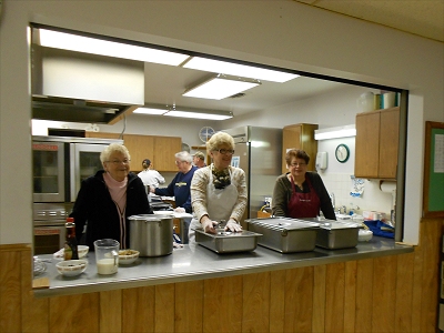 Senior Center volunteers serving breakfast.